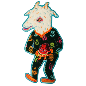 Colorful embroidered patch of a goat eating watermelon on a white background. 