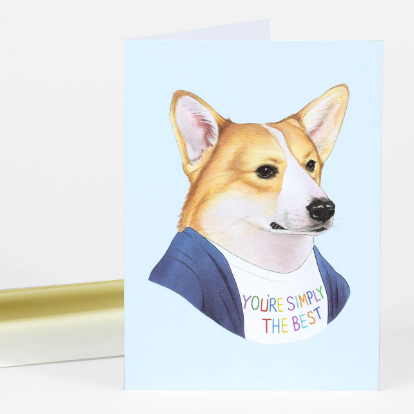 Card with a corgi dog wearing a shirt saying 'You're simply the best' on a light blue background.