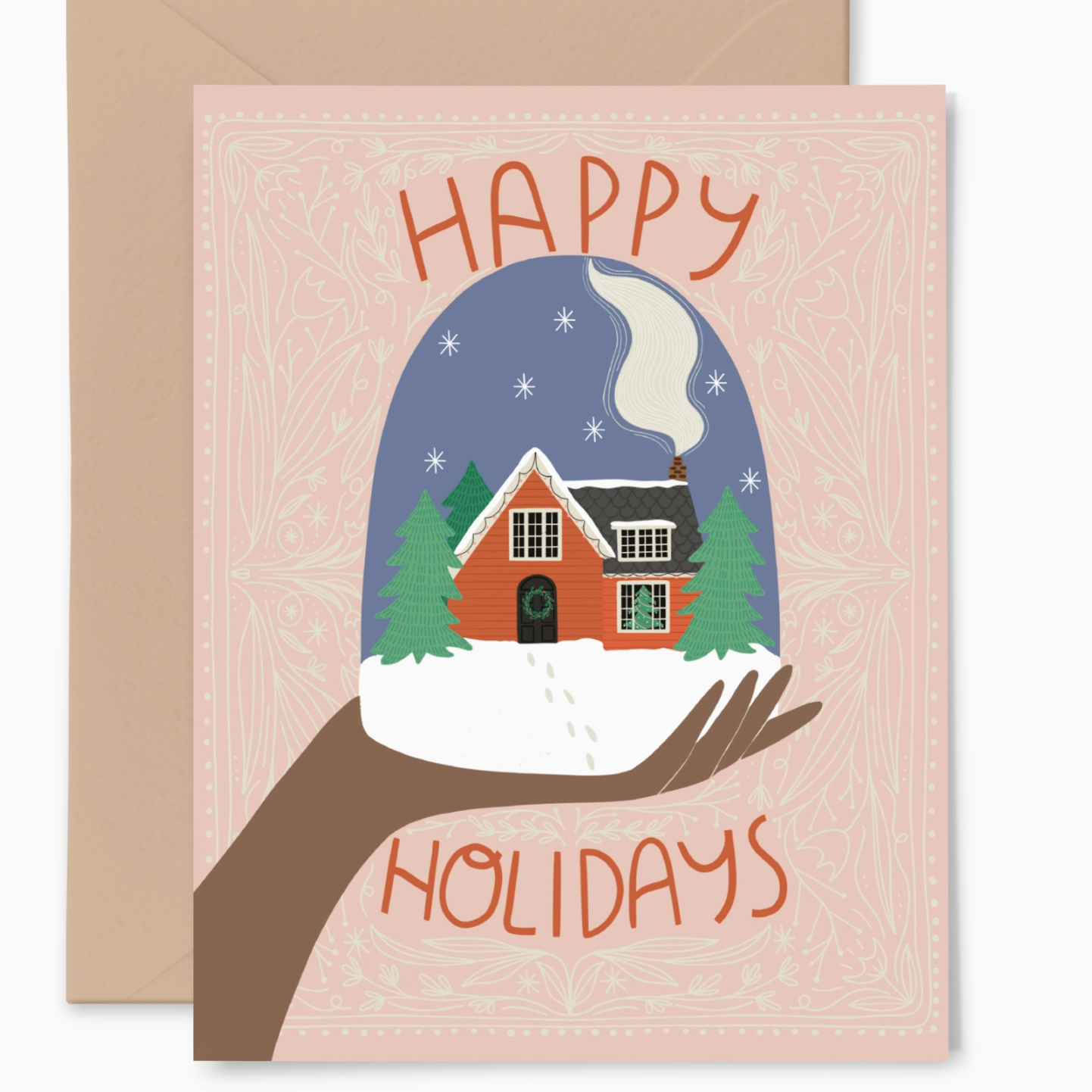 A dark skinned hand is holding up a snow globe with a cozy red house with smoke coming out of the chimney. 