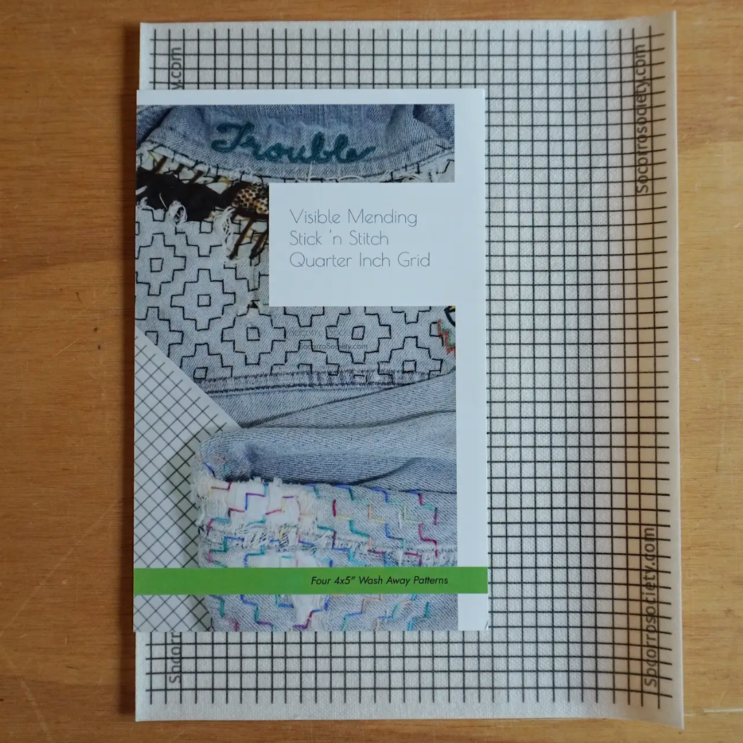 Pattern book with grid on a wooden surface
