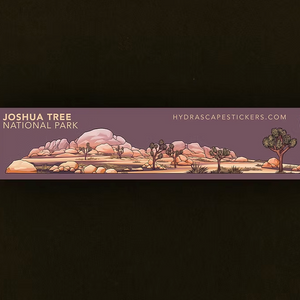 Sticker of Joshua Tree National Park design with desert landscape and snake illustration on a dark background.