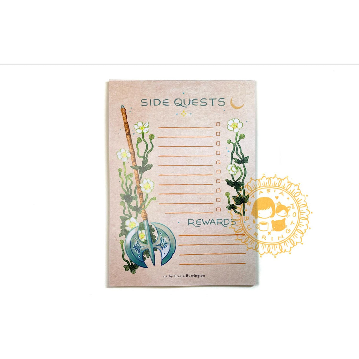 Notebook with floral design and ax, labeled 'Rewards', on a white background.