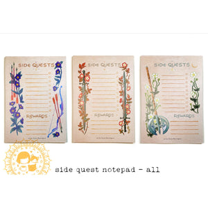Three 'Side Quests' notepads with illustrations on a white background. 
