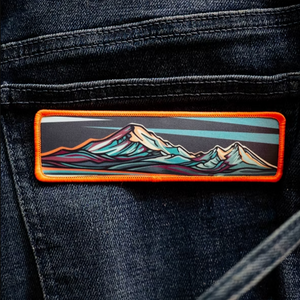 Mountain-themed patch on a denim jacket