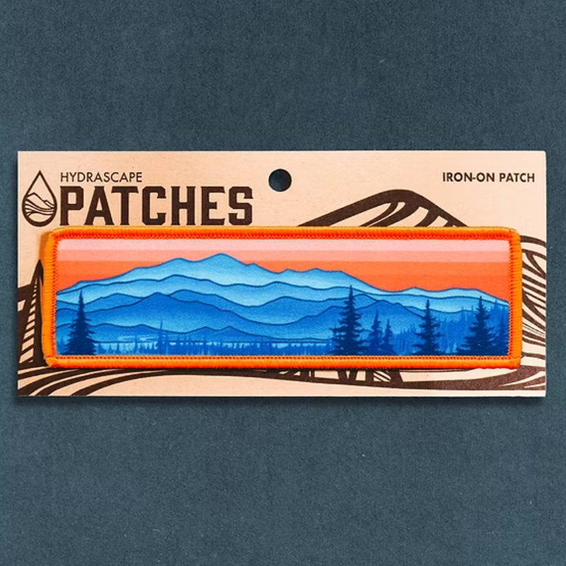 Iron-on patch with Appalachian mountain design on a blue background. 