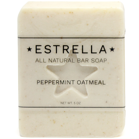 A bar of Estrella all natural peppermint oatmeal soap with a star stamp on the front.