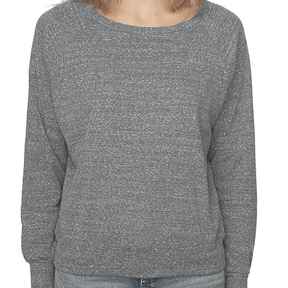 Person wearing a gray sweater and jeans on a white background. 
