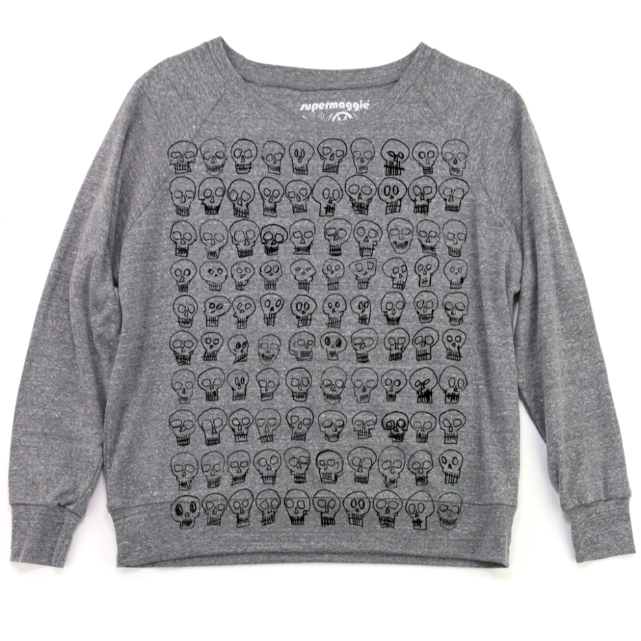 Gray sweatshirt with black skull pattern on a white background. 