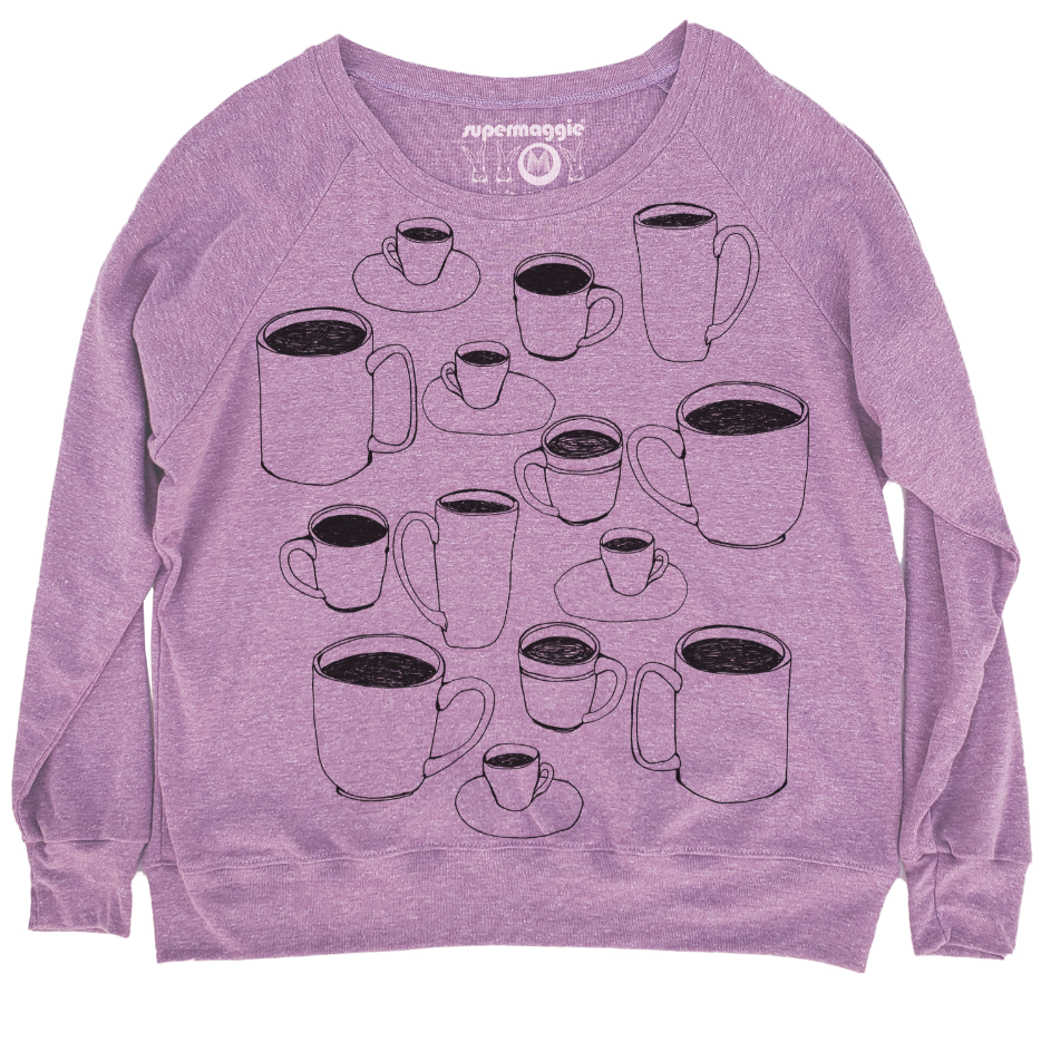 Purple sweatshirt with black coffee cup graphics on a white background. 