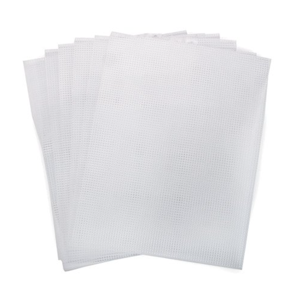 Stack of white plastic canvas sheets on a white background