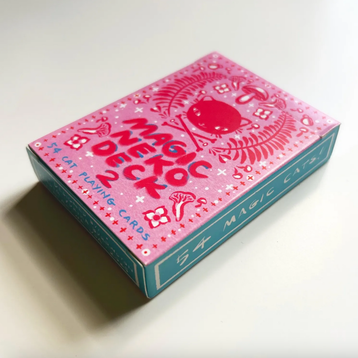 Pink and blue deck of cards with 'Magic Neko' branding on a white background. 