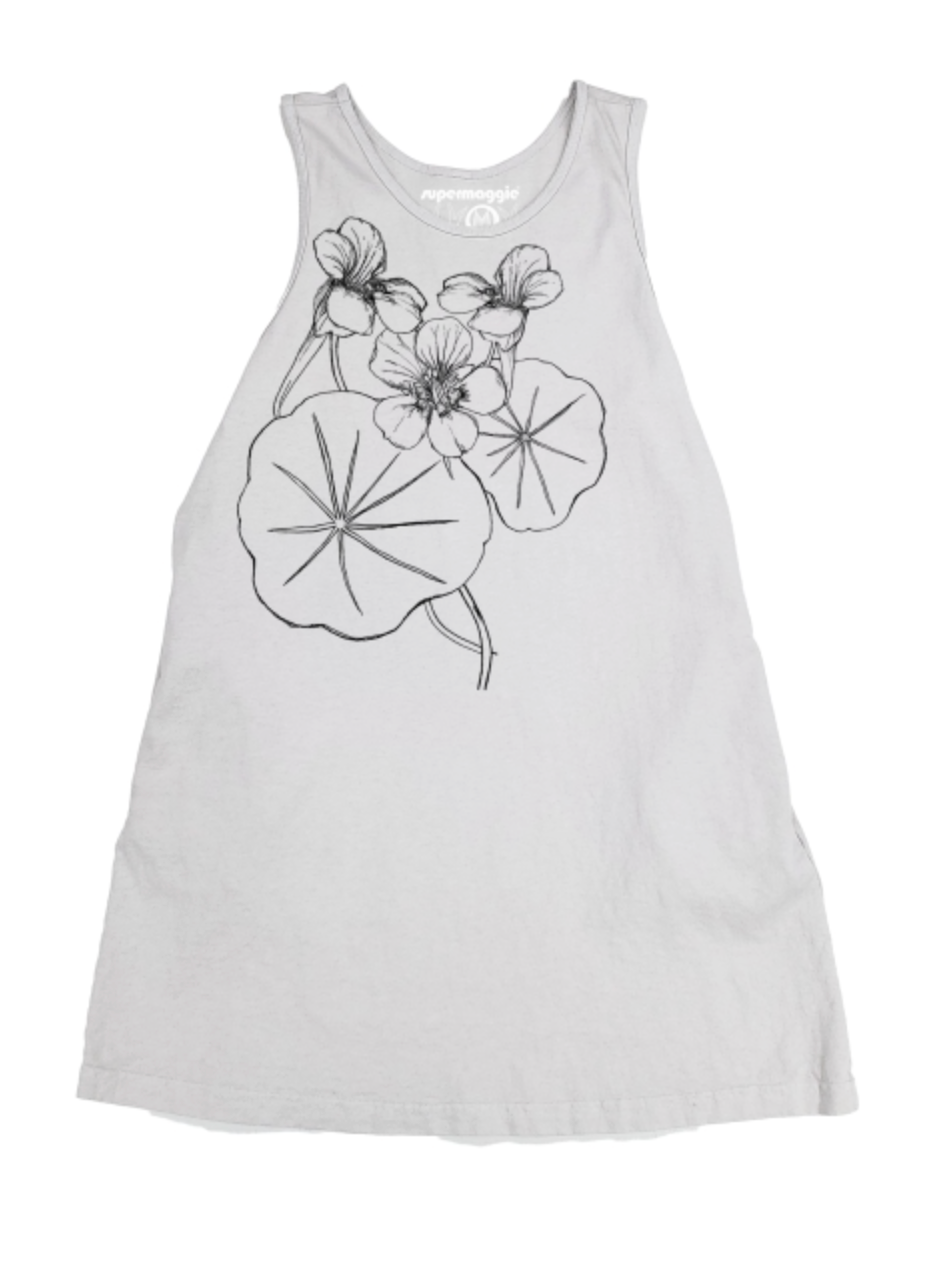 A sleeveless white tank dress featuring a black line art graphic of flowers and lily pads on the front, displayed against a plain white background.