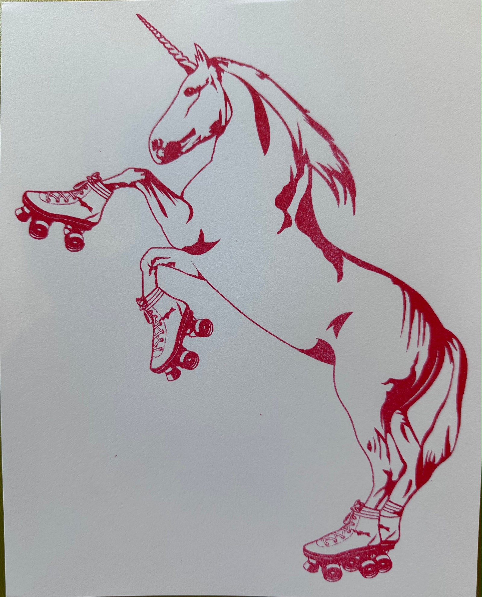Red unicorn with roller skates on a white background