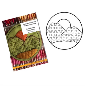 Packaged sashiko inspired stitching kit with a mountain design and a diagram of the pattern on a white background.n