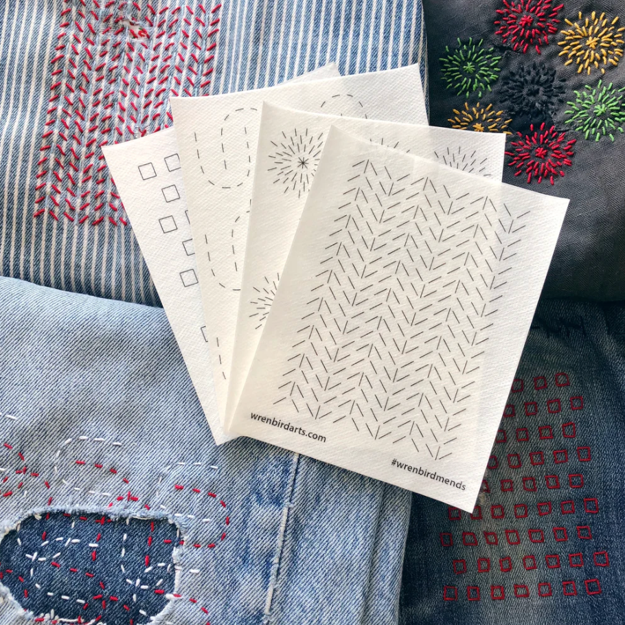 An example of each of four sashiko visible mending designs in shown in pattern form - and also stitched onto denim.