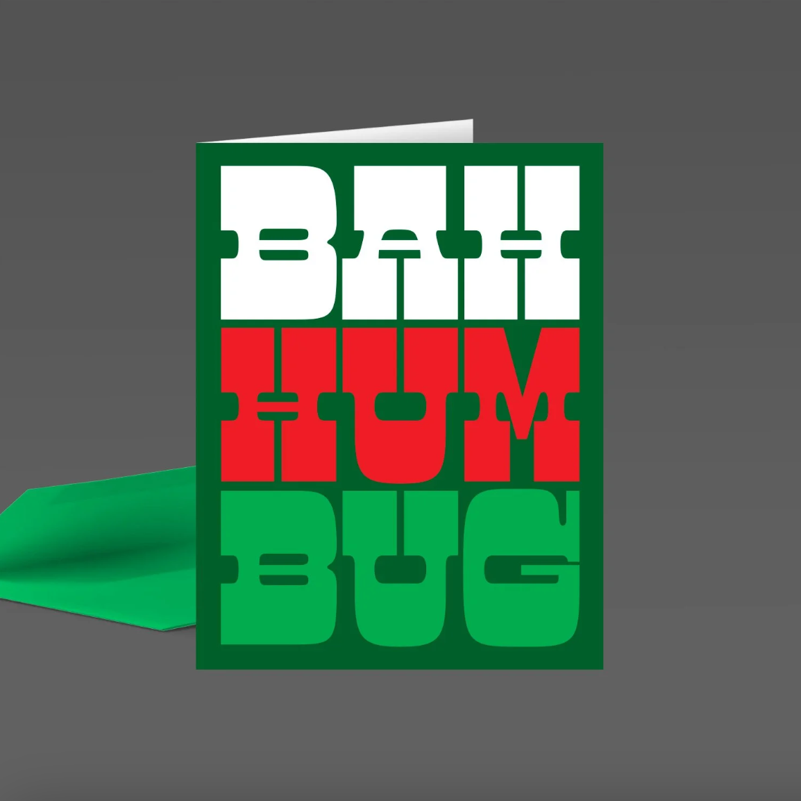 Green card with 'Bah Hum Bug' text in white, red and green on a gray background.
