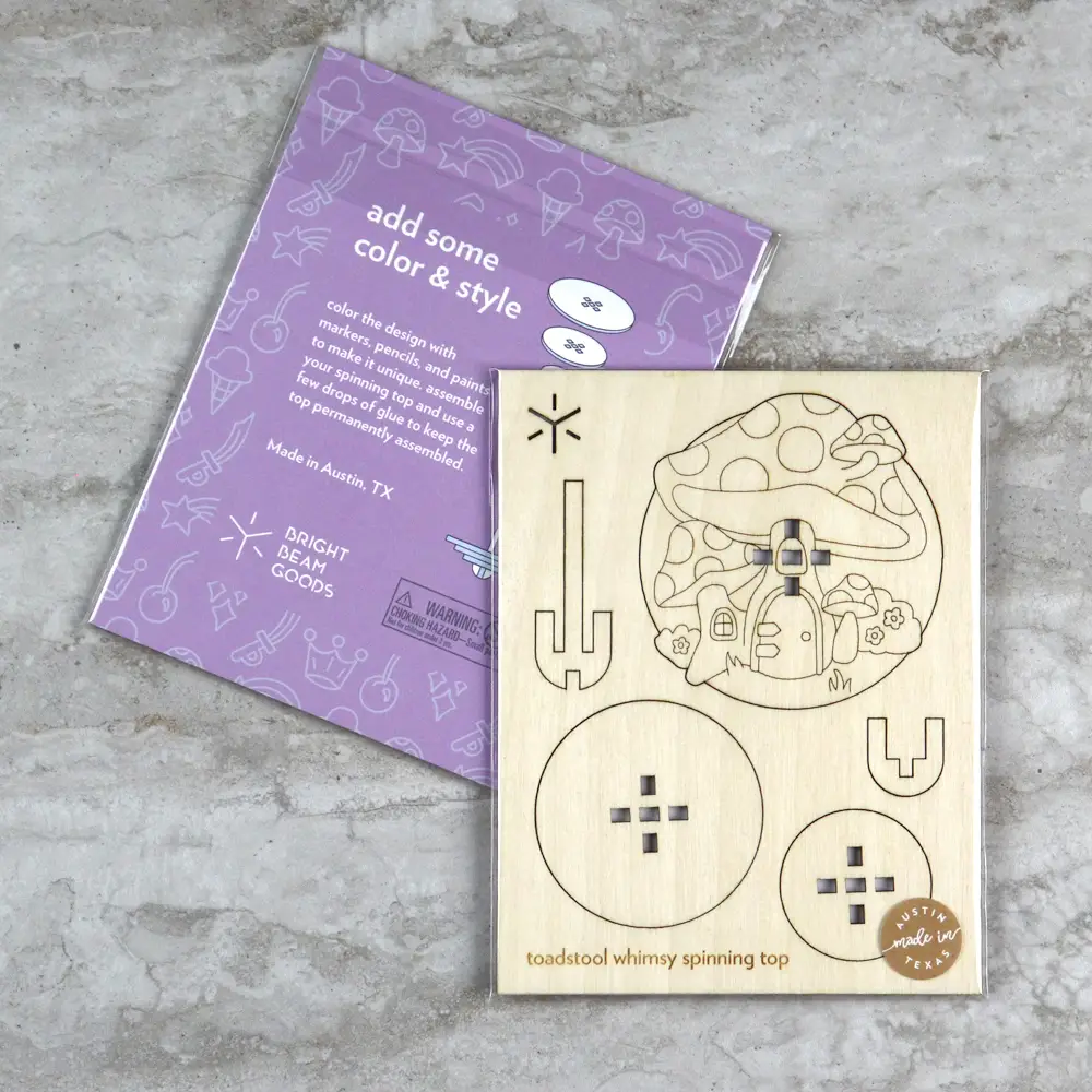 Flatpack image of wooden toadstool spinning top kit. 