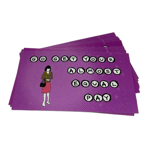 A stack of purple rectangular stickers with a halftone pattern, featuring the text 'GO GET YOUR ALMOST EQUAL PAY' in black-and-white alphabet letter beads and an illustration of a woman in a brown jacket and pink skirt holding a black handbag.