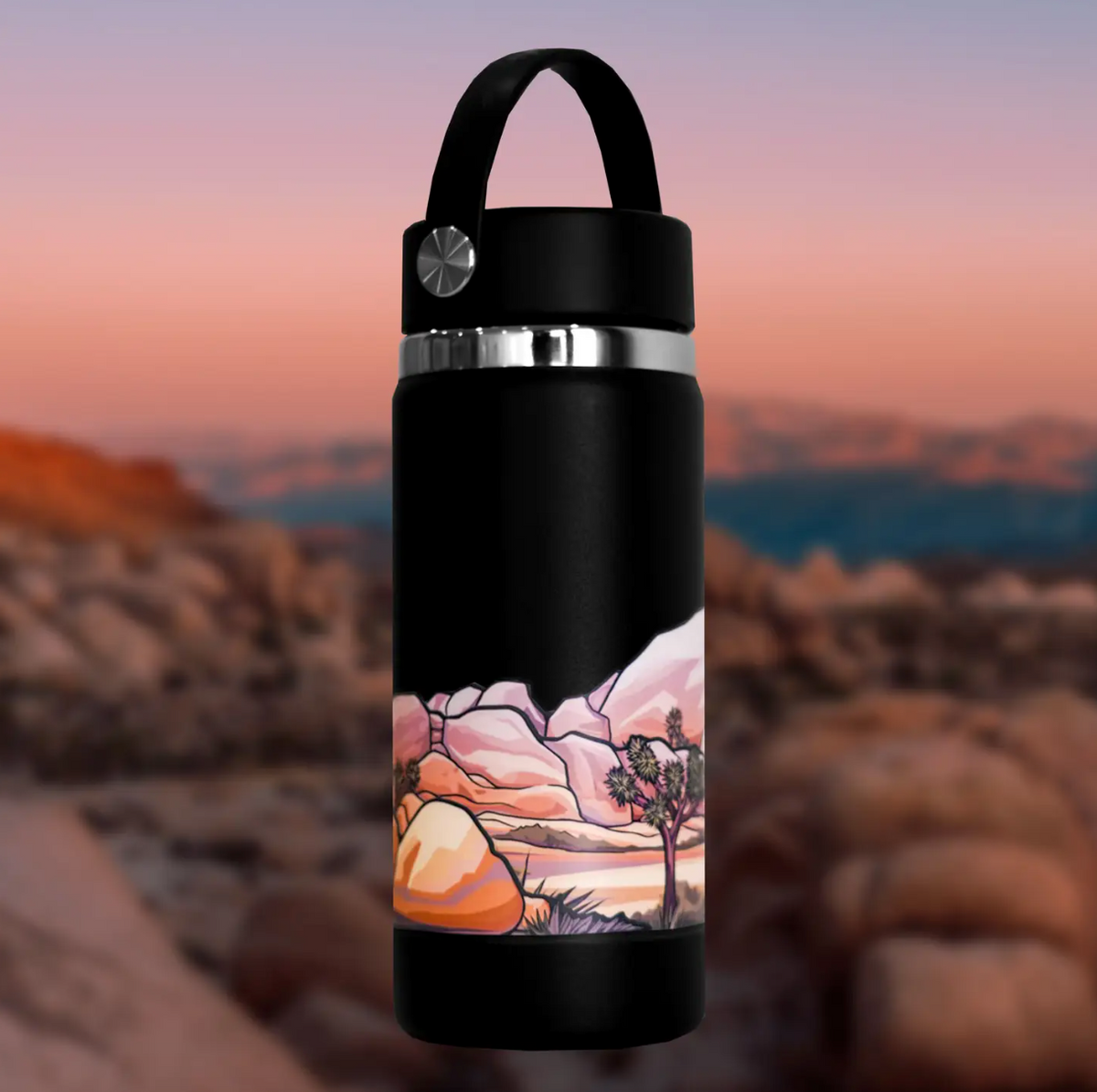 Black water bottle with Joshua Tree landscape design against a mountainous background. 