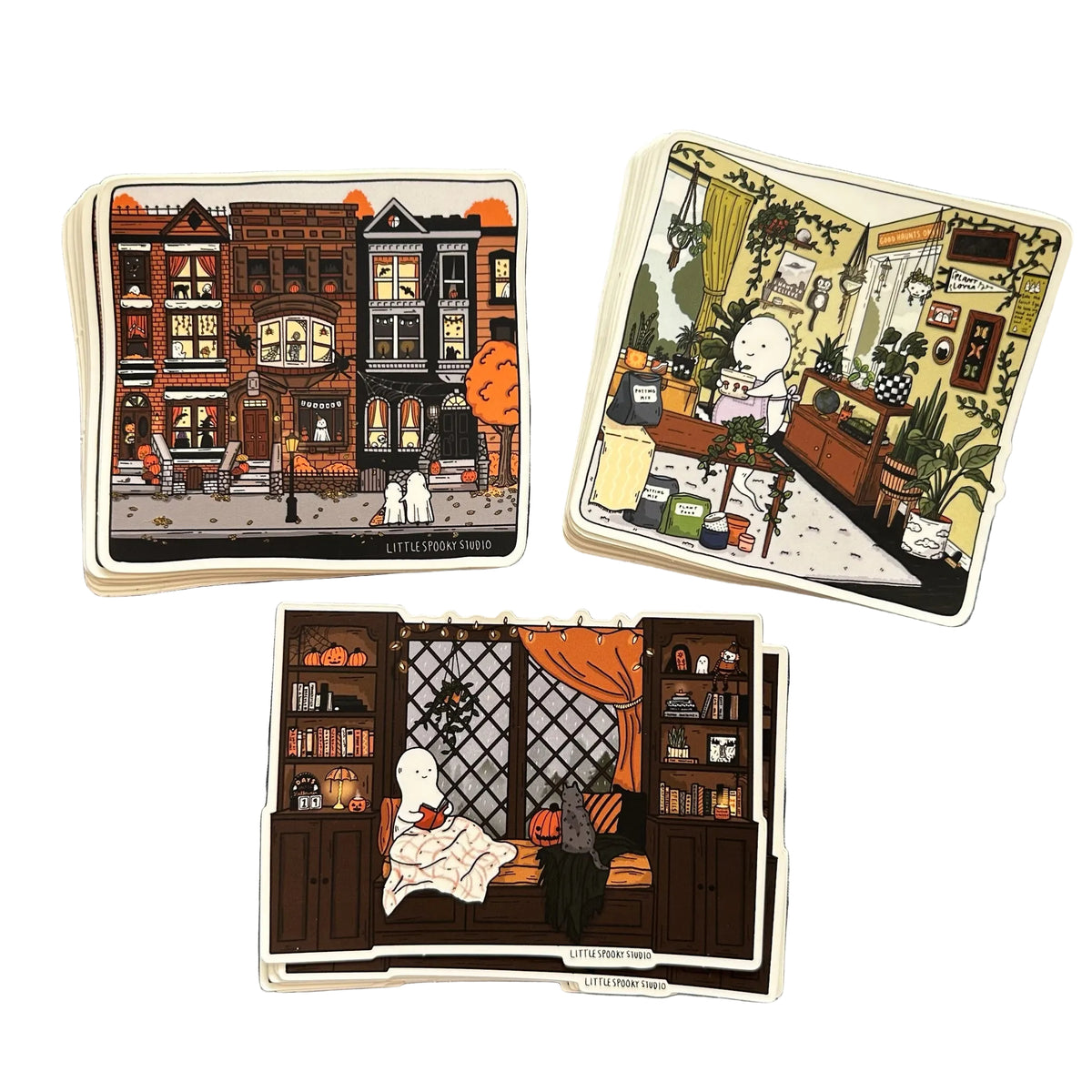 Three stickers by Little Spooky Studio - a cityscape with ghosts taking a walk, a ghost watering plants and a ghost reading on a rainy day. 