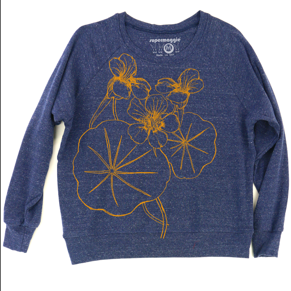 Blue sweatshirt with yellow floral design on a white background.
