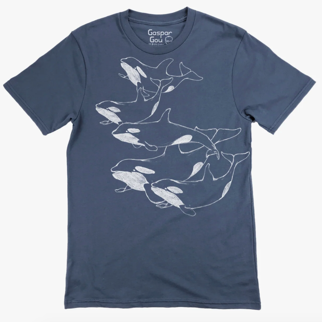 Blue t-shirt with white orca illustrations on a white background.