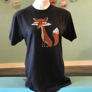 A mannequin wearing a charcoal gray t-shirt with a fox wearing glasses. 