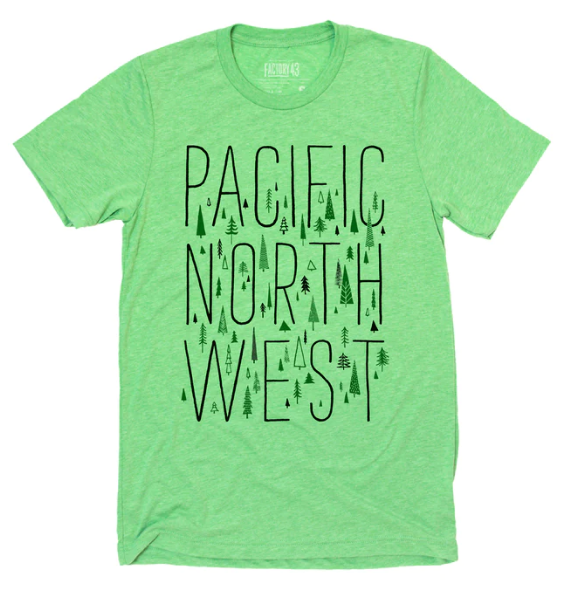 Green shirt that says "Pacific North West" and has a variety of evergreen trees. 