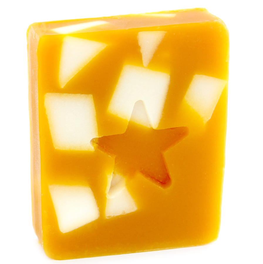 A bar of handmade soap with a distinct orange color and a star shape cut out in the center.