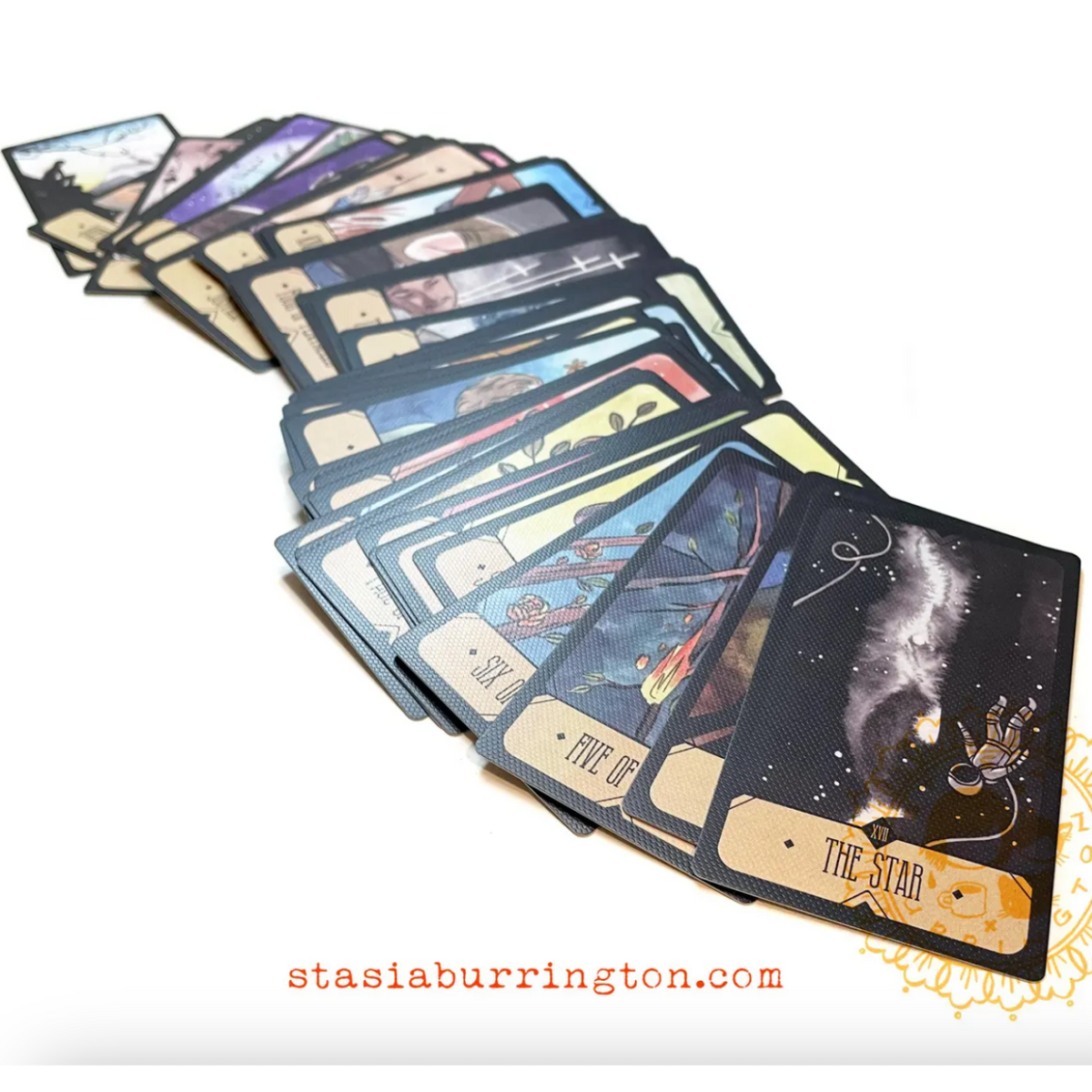 Set of tarot cards with artistic designs on a white background, featuring the brand 'stasia burrington'.