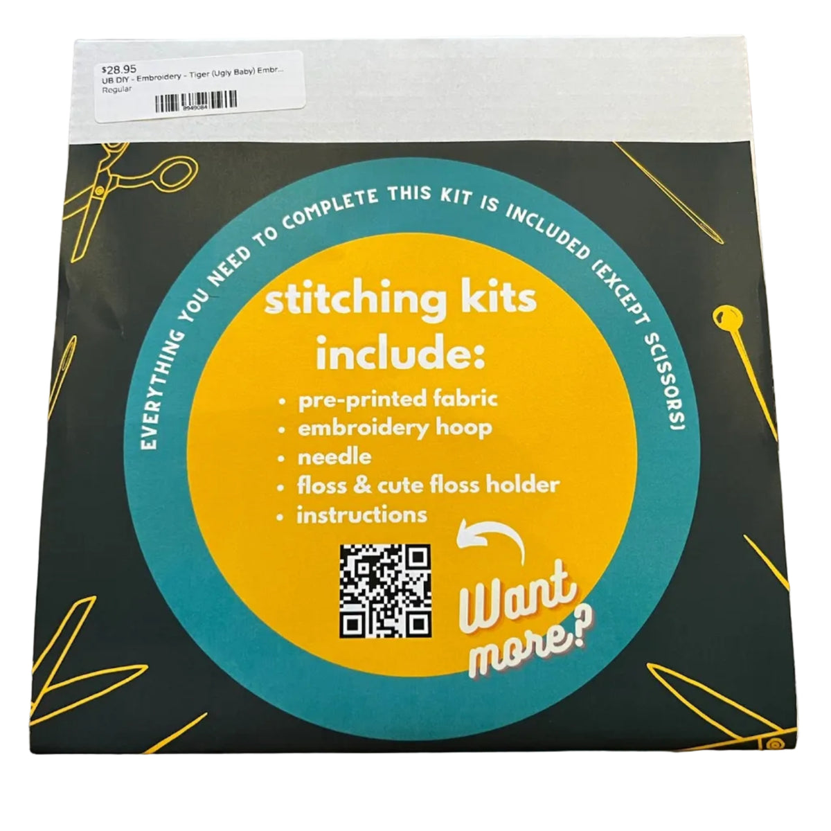 A square product box for an embroidery kit. The packaging is forest green with a large yellow circle and teal ring, plus white text listing included items such as pre-printed fabric, embroidery hoop, needle, thread, and instructions.