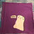 A ghost that is also a kitty says "Mew." The cat is white and printed on a dark purple kitchen towel that measures 30" x 30".