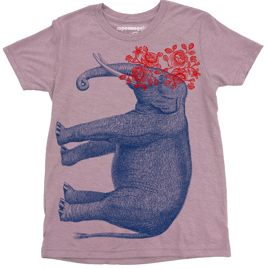 Lavender t-shirt with a blue elephant and red flowers design on a white background. 