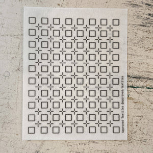 Visible mending pattern sticker featuring a tessellation of squares with plus signs in between them. 