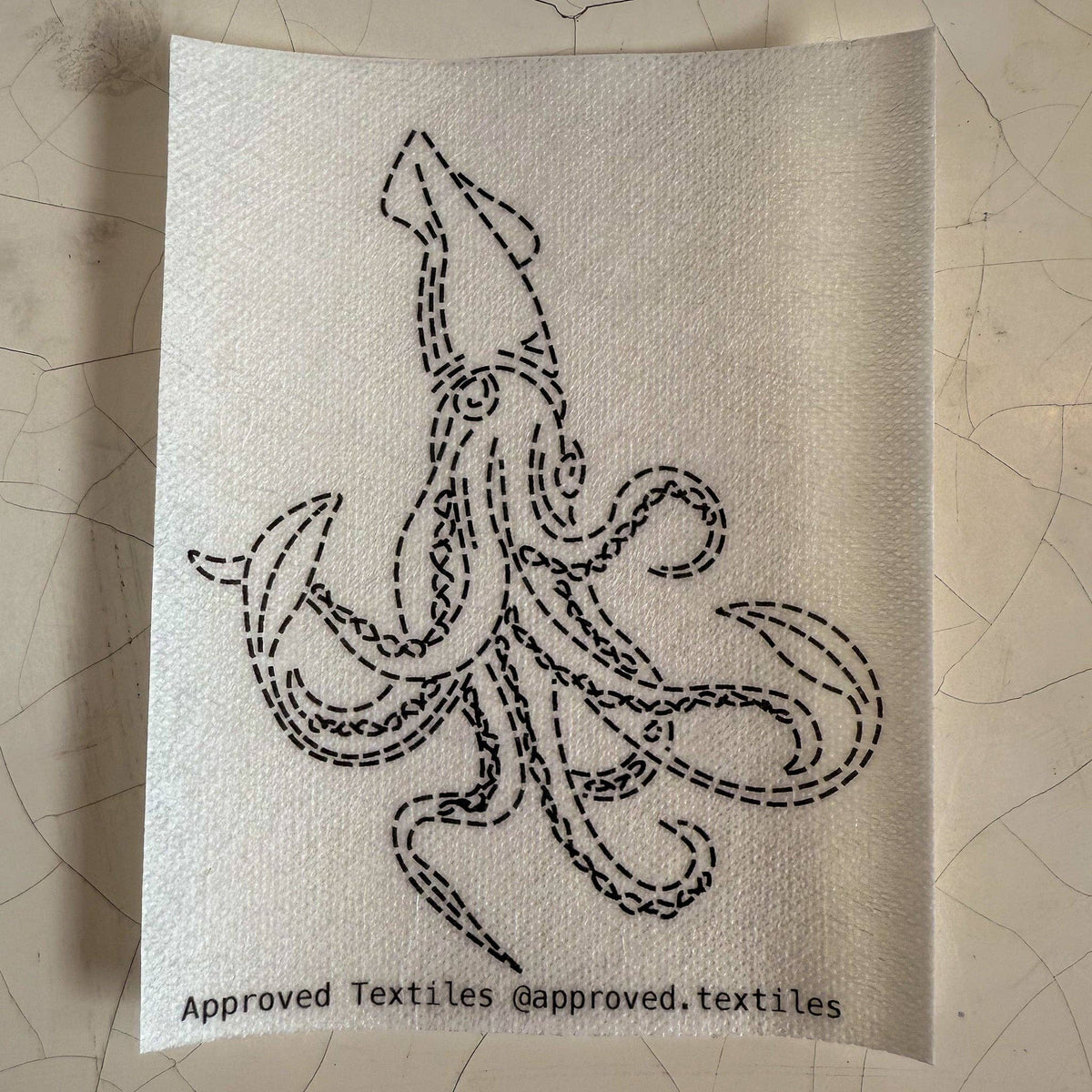 Visible mending pattern sticker featuring a giant squid design. 