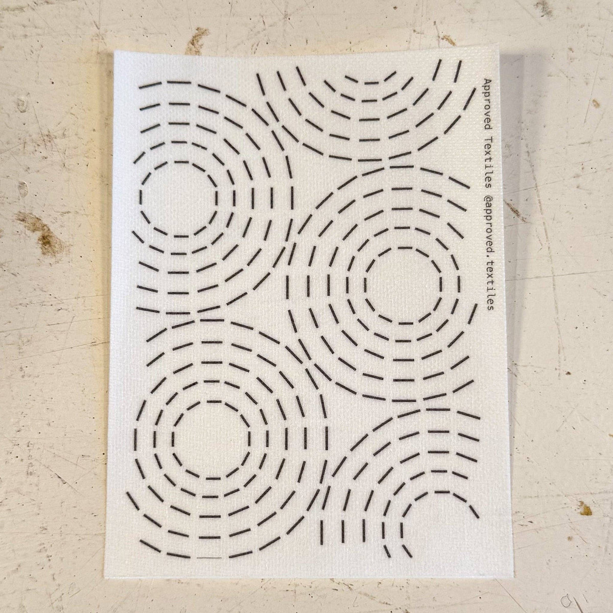 Visible mending pattern sticker featuring a design of concentric circles