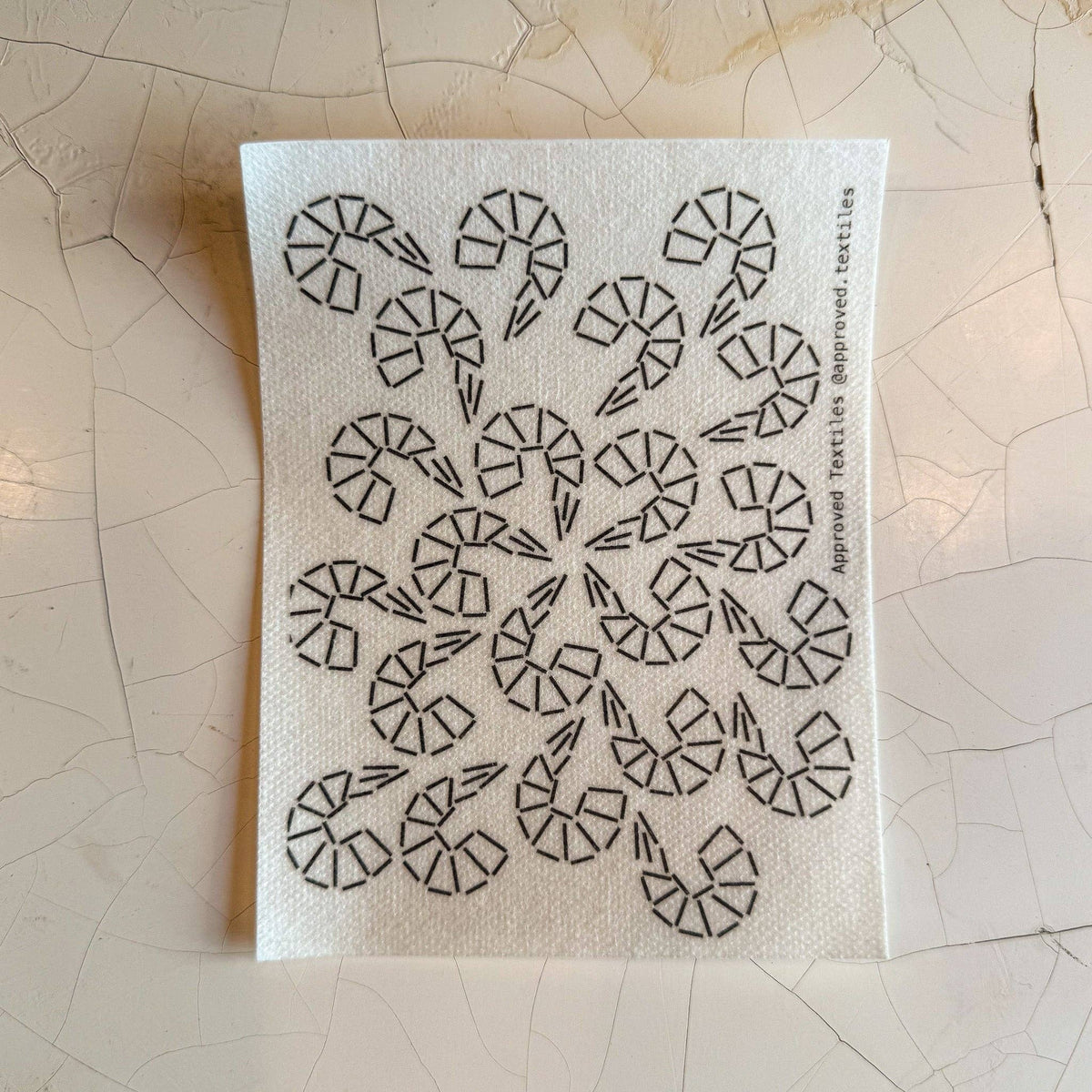 Visible mending pattern sticker featuring a grouping of shrimp emanating out from the middle of the sticker. 