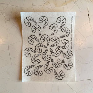 Visible mending pattern sticker featuring a grouping of shrimp emanating out from the middle of the sticker. 