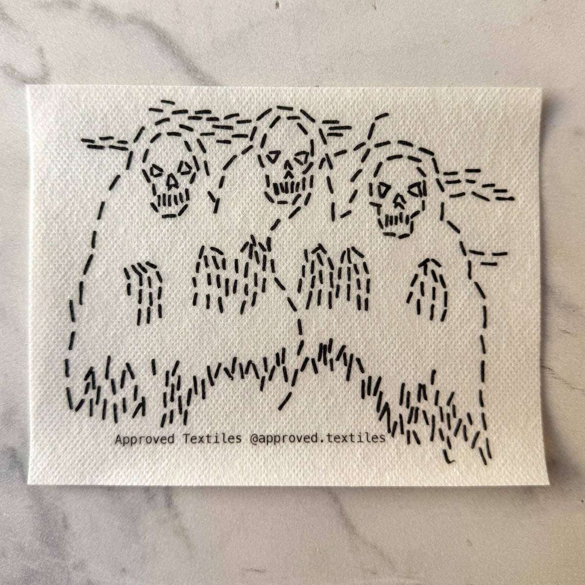 Visible mending pattern sticker featuring three spooky skeletons in robes