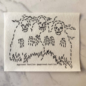 Visible mending pattern sticker featuring three spooky skeletons in robes
