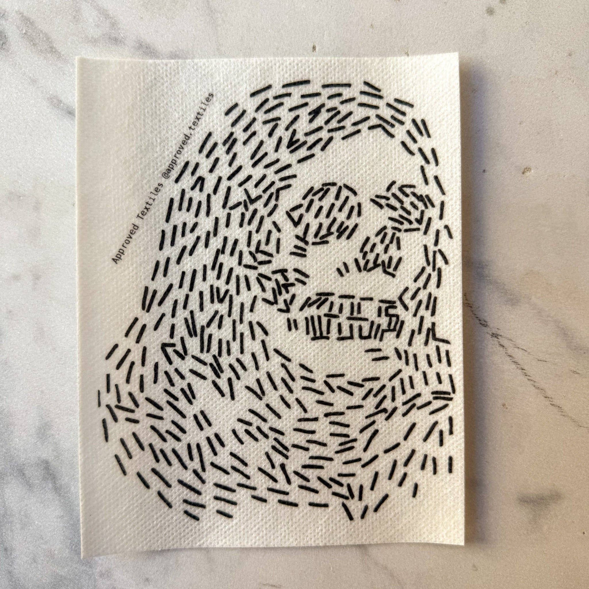 Visible mending pattern sticker of a hooded skeleton face
