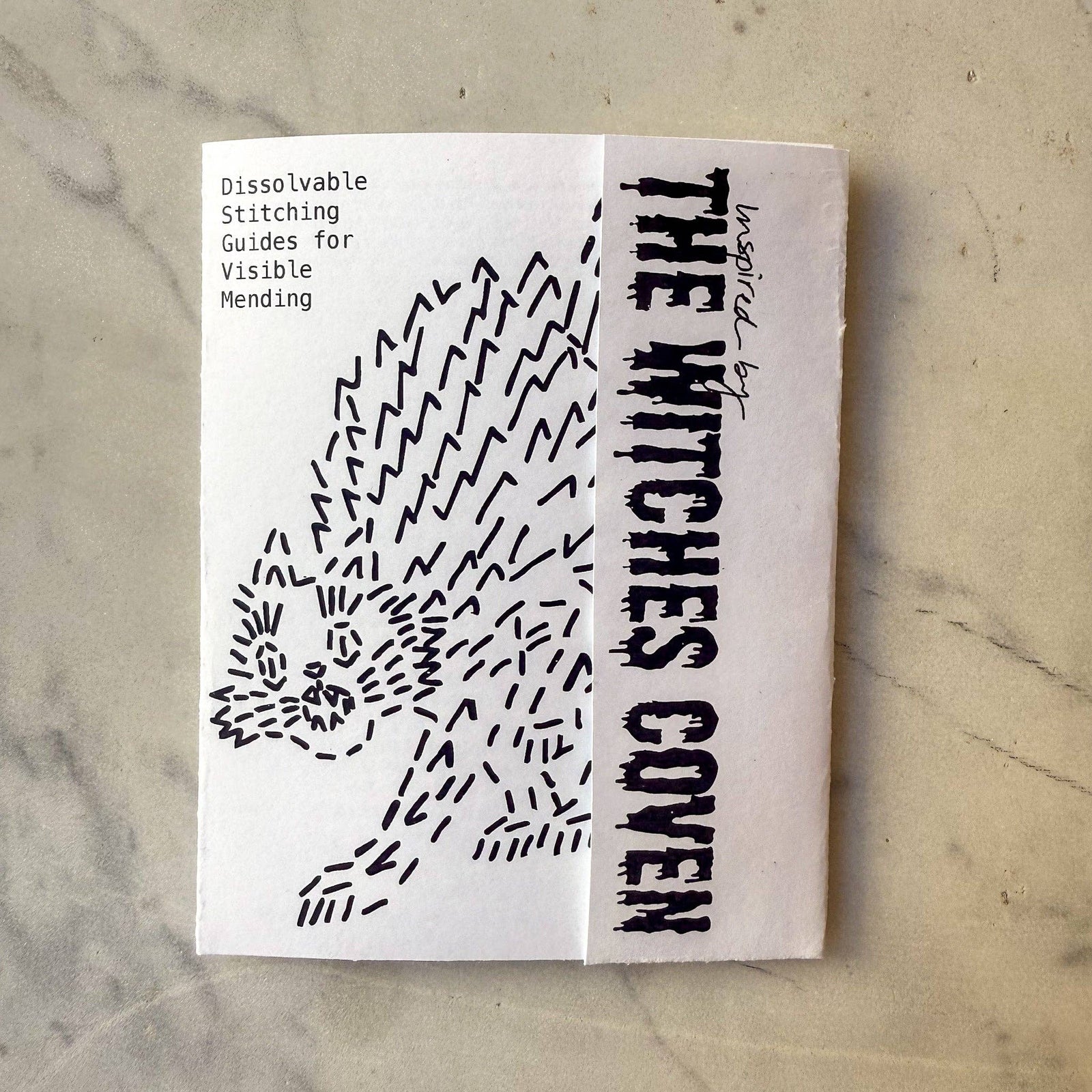 Packaging for witchy-themed visible mending pattern stickers featuring a cat drawing and text that says 'The Witches Coven"