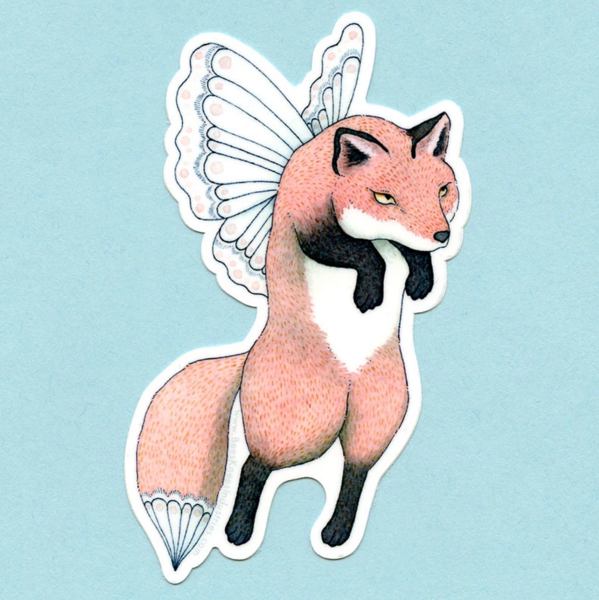 A sticker of a fox with white fairy wings against a blue background.