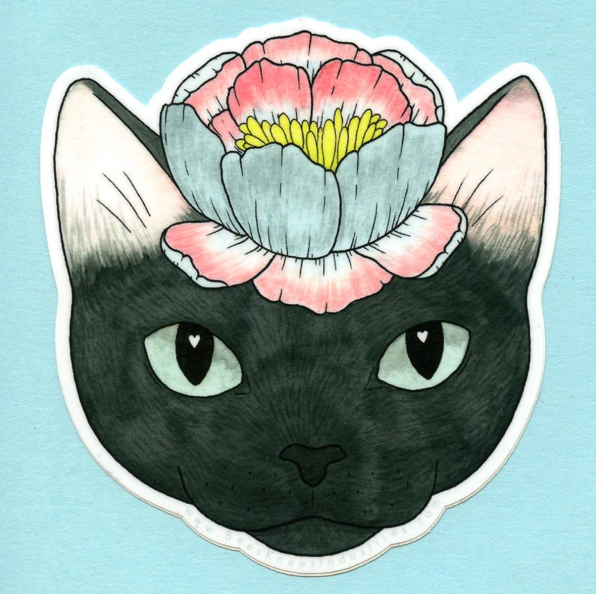 Sticker of a black cat with a pink and gray flower on its head against a blue background.