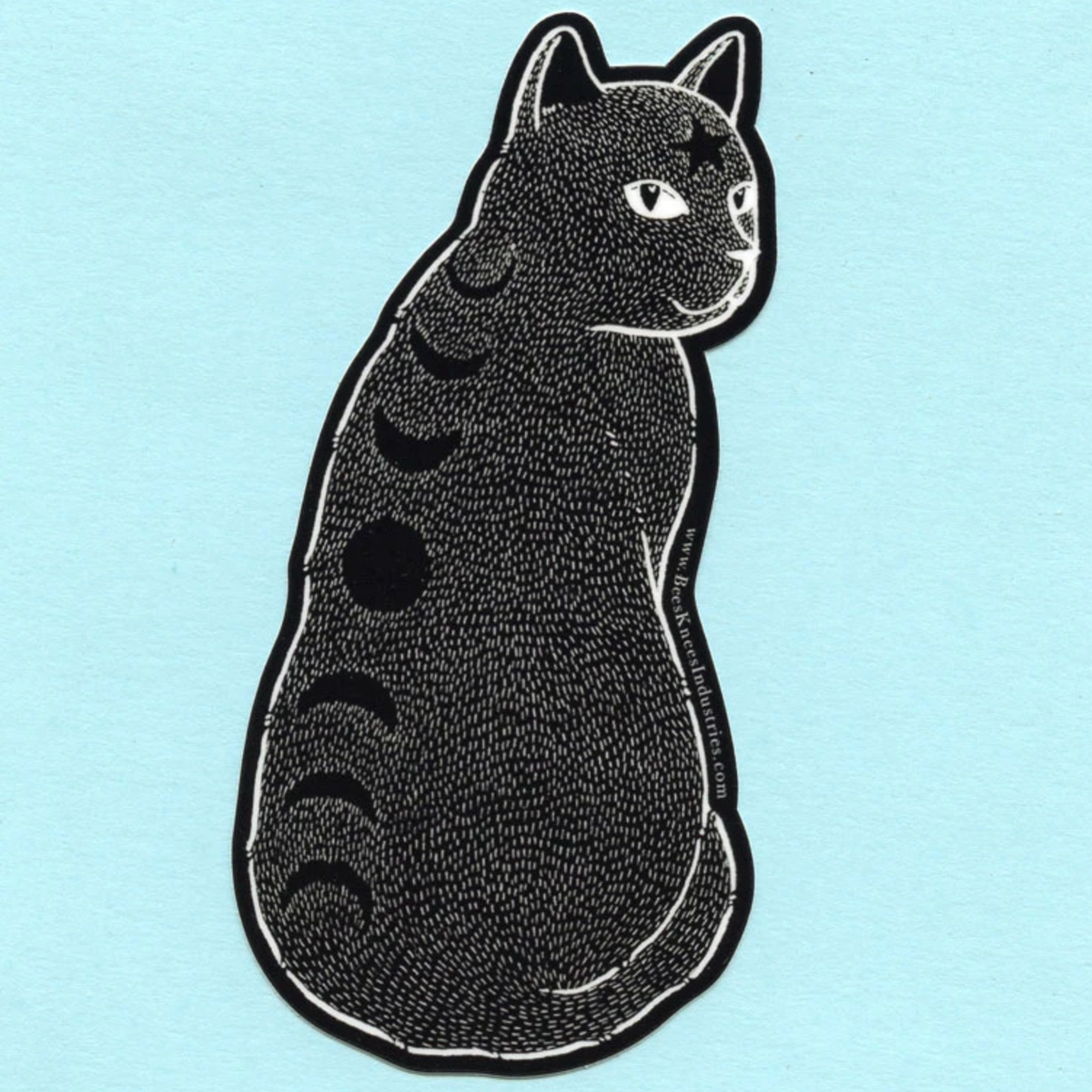 A sticker of a black cat with moon phases down its back and a star on its forehead. 