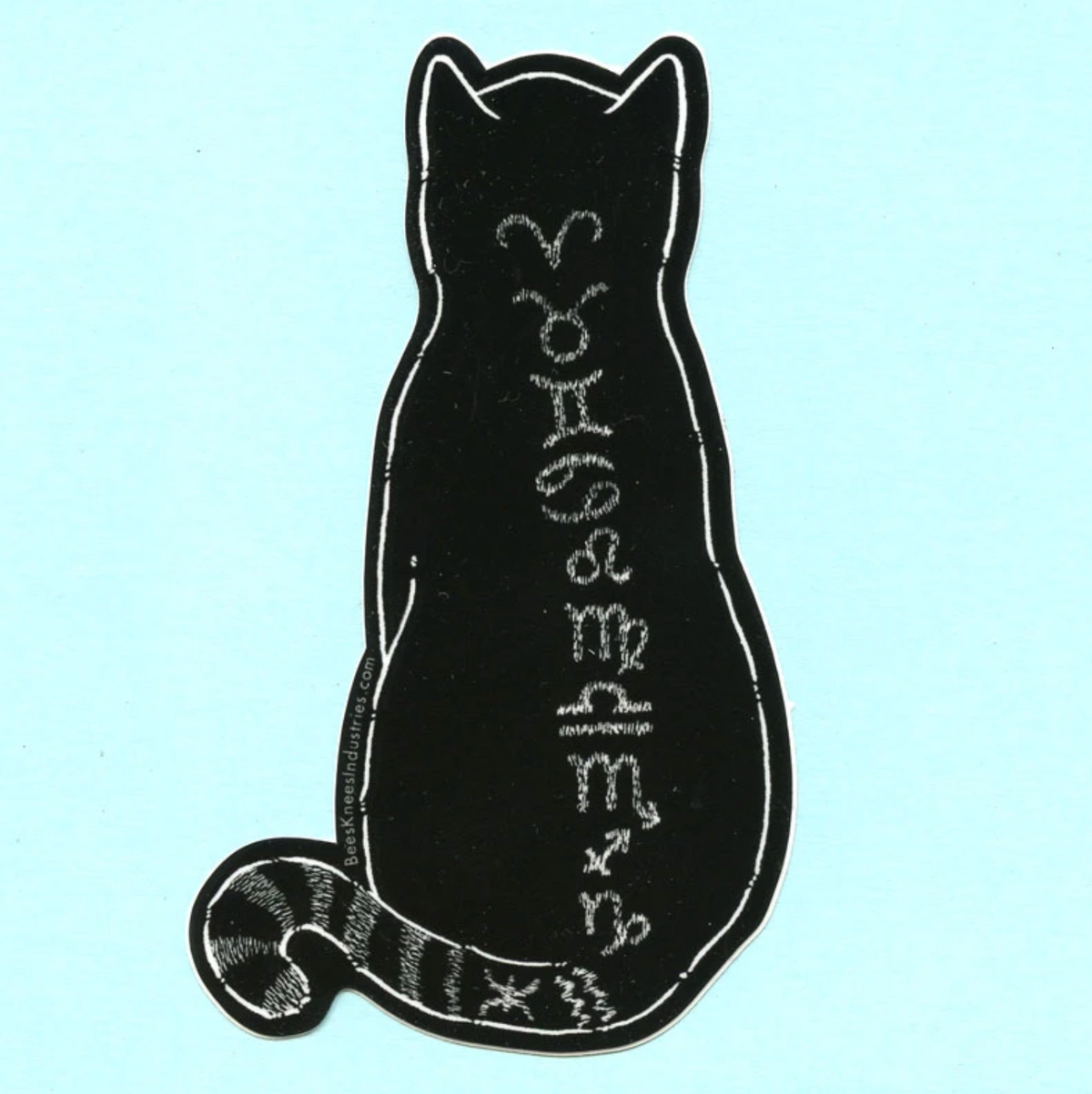 A sticker of a black cat with white zodiac signs down its back against a light blue background. 