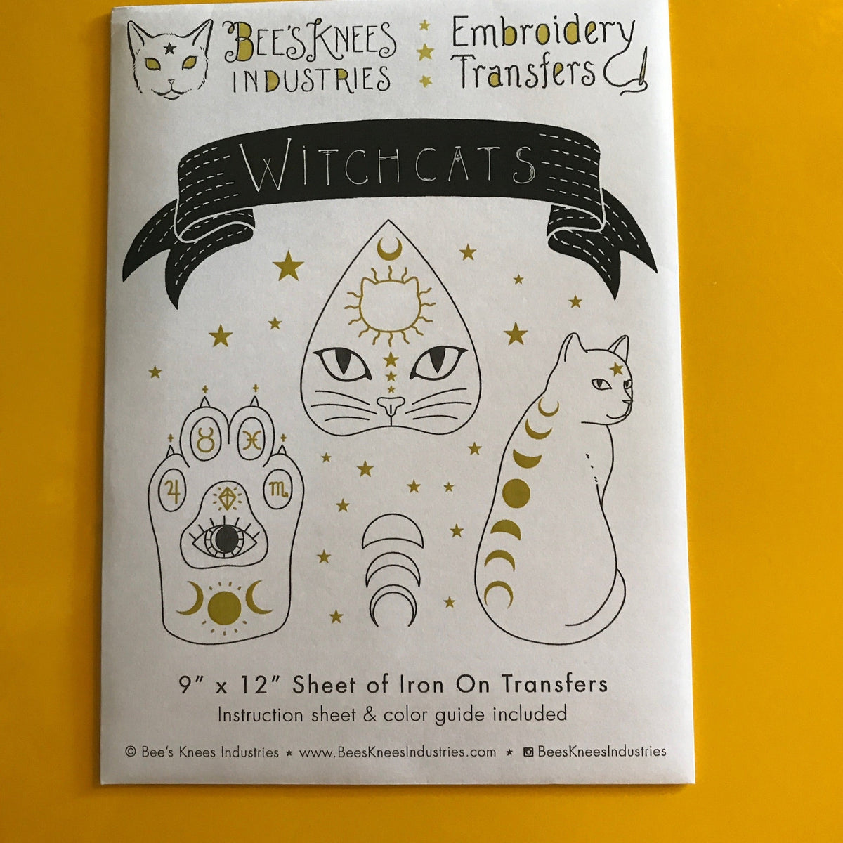 White envelope that says "Bee's Knees Industries Embroidery Transfers: Witchcats" and has illustrations of a cat's paw, a planchette, and a cat with moons on its back.