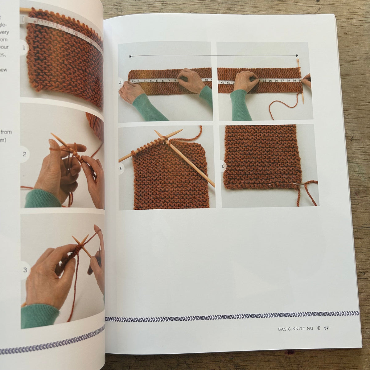 An open knitting book showing a brown knitted swatch and step-by-step photos of hands measuring and knitting with wooden needles on a light wood surface.