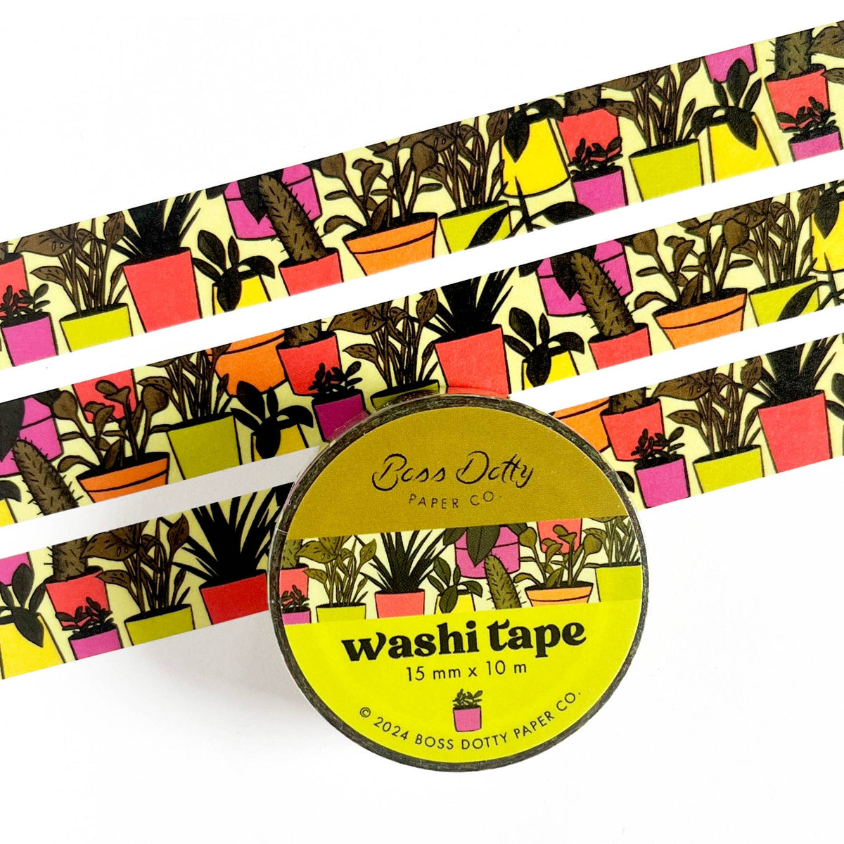 Washi tape with plant pattern and a cylindrical container labeled 'Boss Dotty Paper Co' on a white background.
