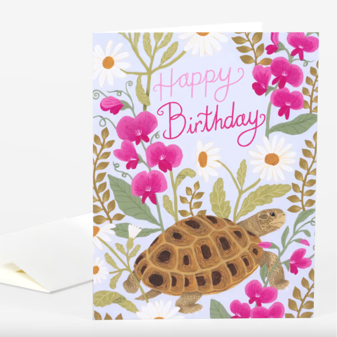 A light blue card featuring a turtle surrounded by daisies and sweet pea flowers with the text "Happy Birthday" in pink script